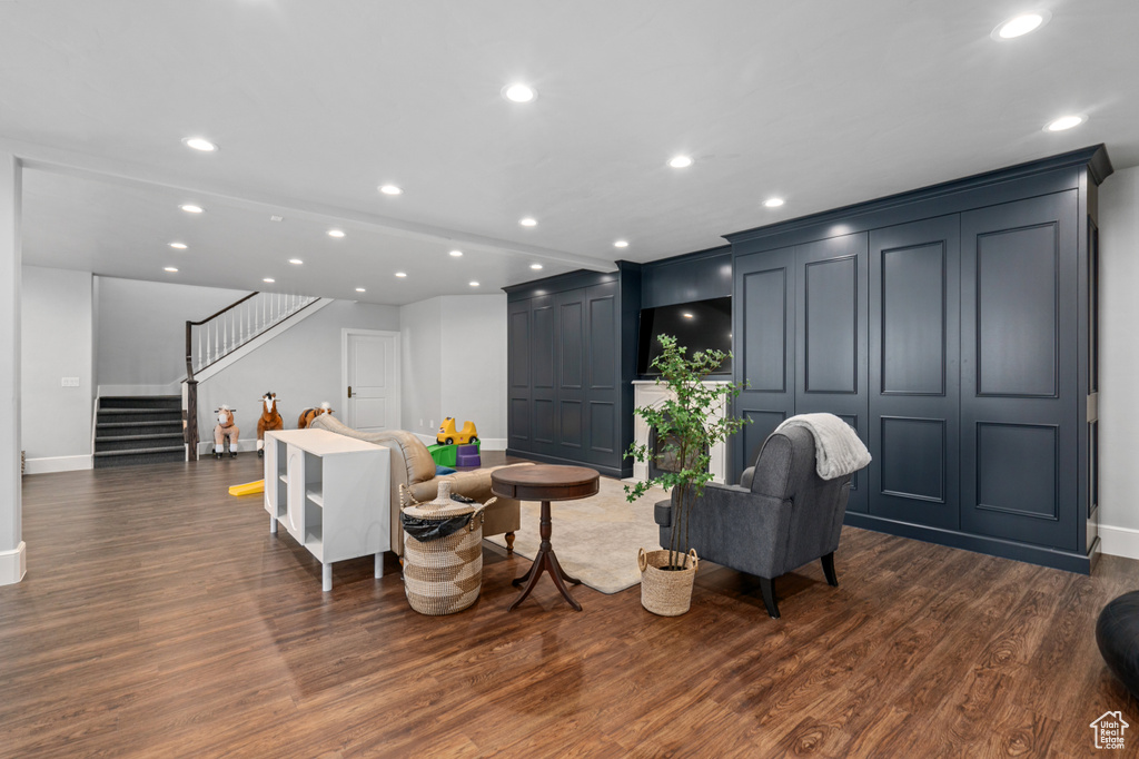 Living room with dark hardwood / wood-style floors