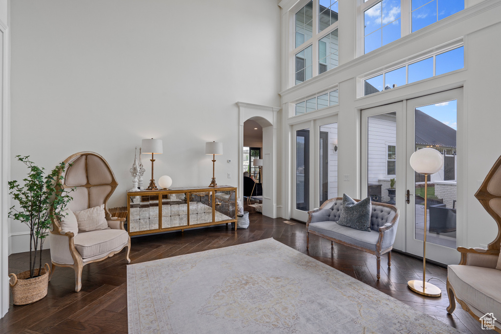 Living room featuring french doors and a towering ceiling