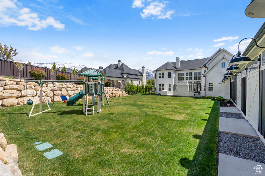 View of yard featuring a playground