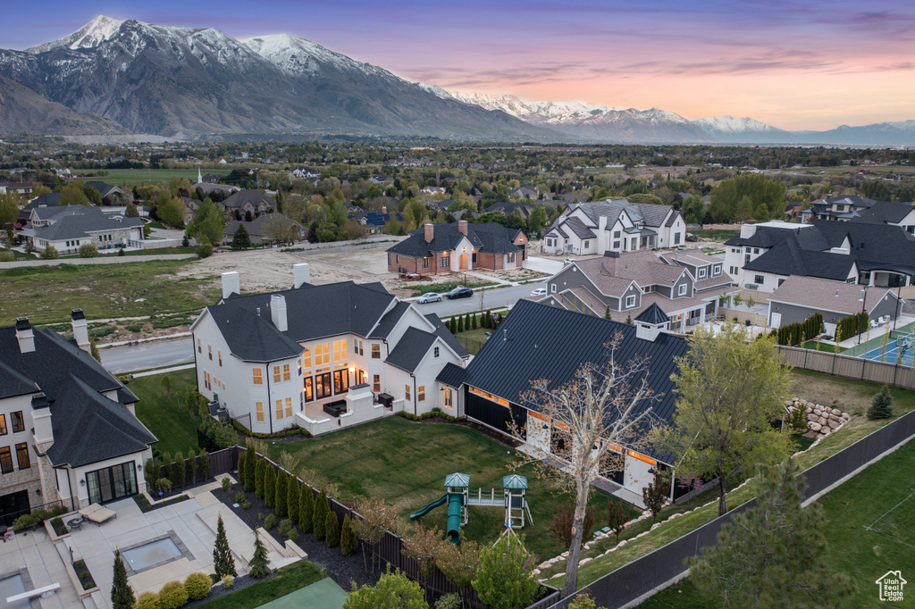 Aerial view at dusk featuring a mountain view