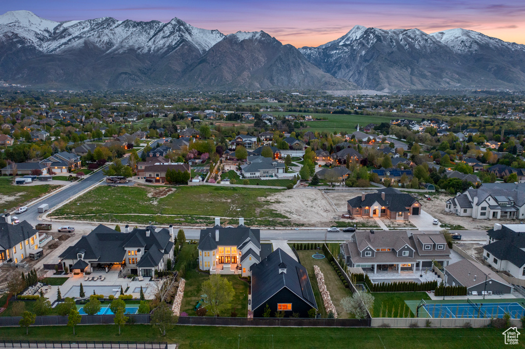 Aerial view at dusk featuring a mountain view