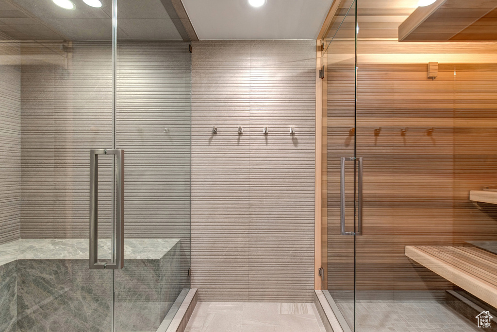 Bathroom featuring tile floors and an enclosed shower