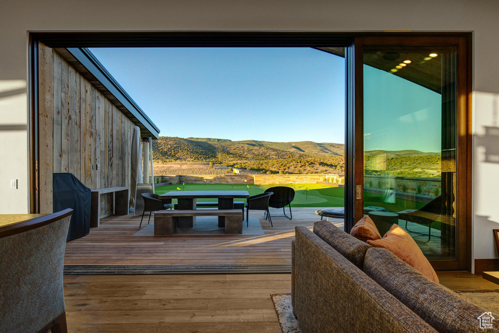 Exterior space with wood-type flooring and a mountain view