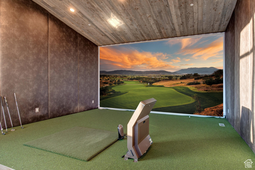 Game room with a mountain view and wood ceiling