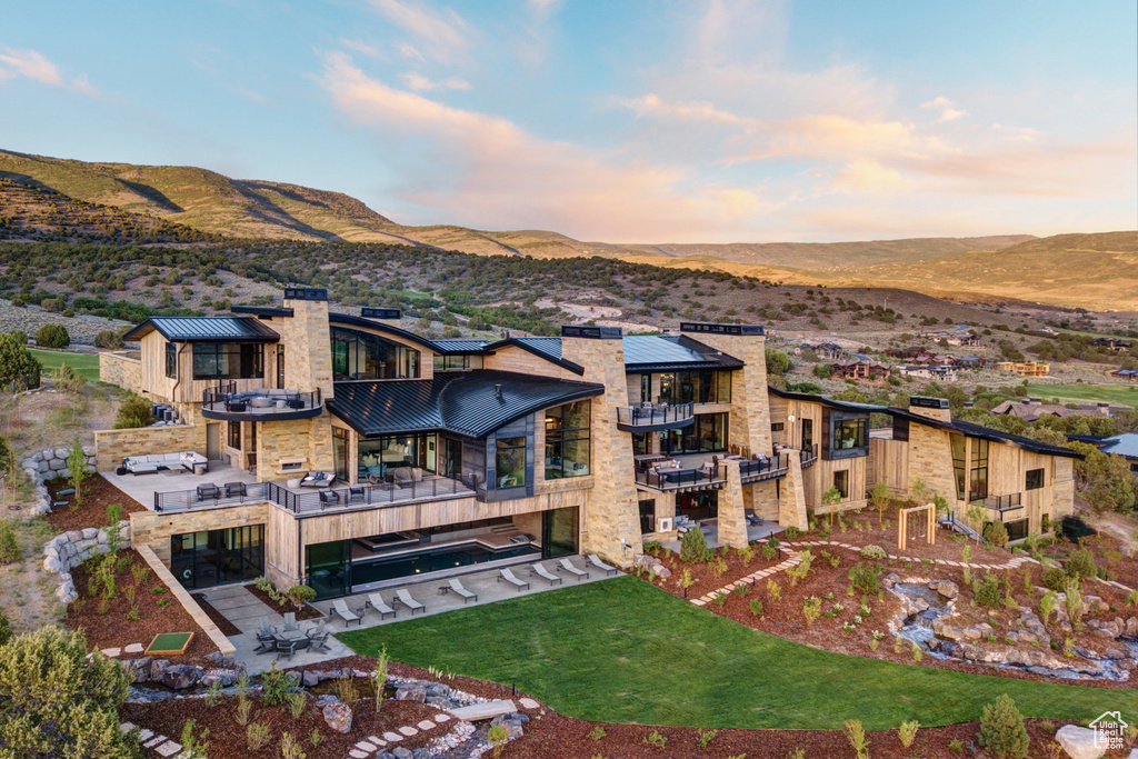 Exterior space with a mountain view and a balcony