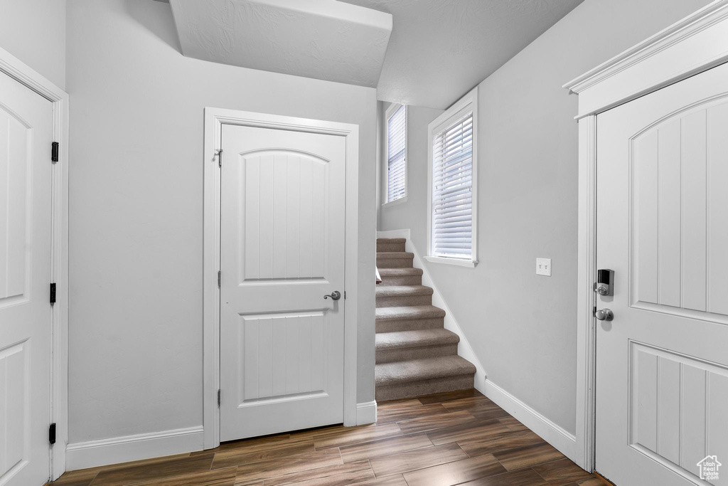 Entrance foyer featuring hardwood / wood-style floors