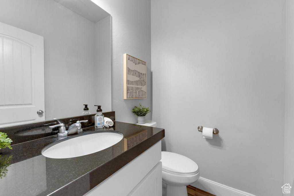 Bathroom with toilet and large vanity