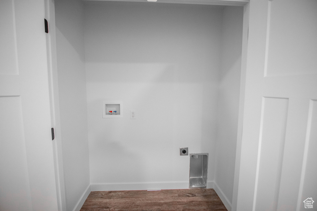 Laundry room featuring hookup for a washing machine, hardwood / wood-style floors, and hookup for an electric dryer