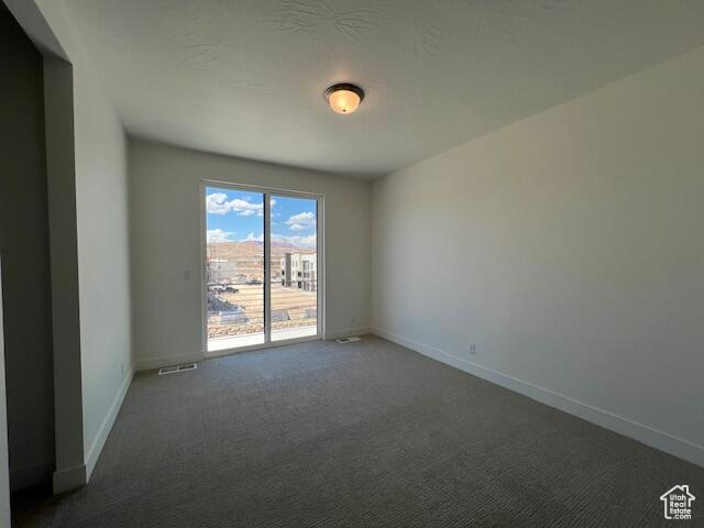 Empty room with carpet flooring