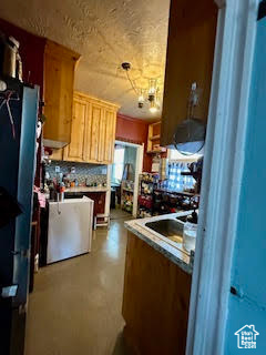 Kitchen with backsplash and fridge