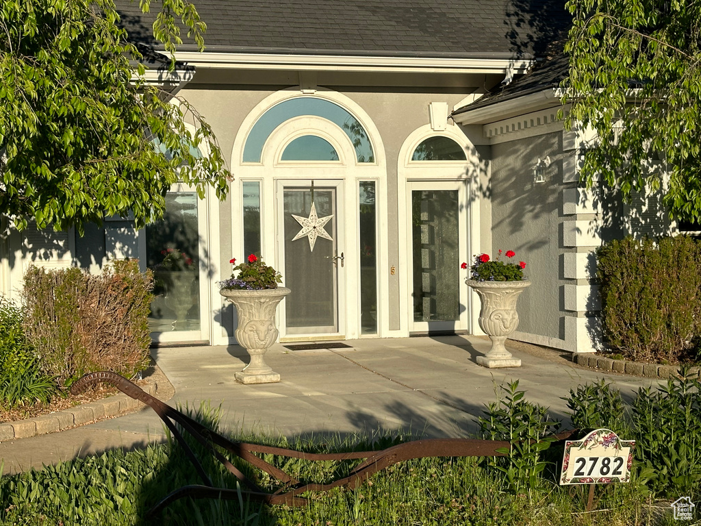 Property entrance featuring french doors