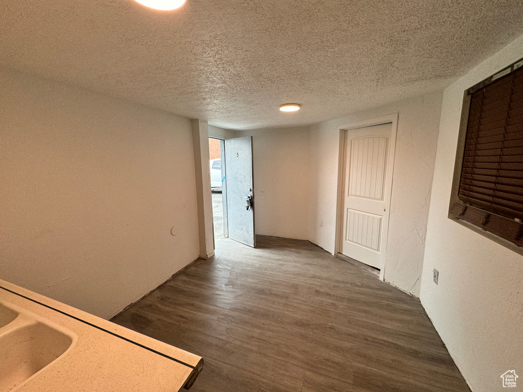 Interior space featuring hardwood / wood-style floors and a textured ceiling