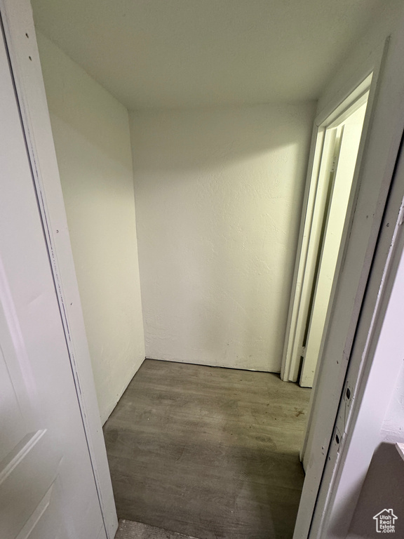 Corridor featuring hardwood / wood-style flooring