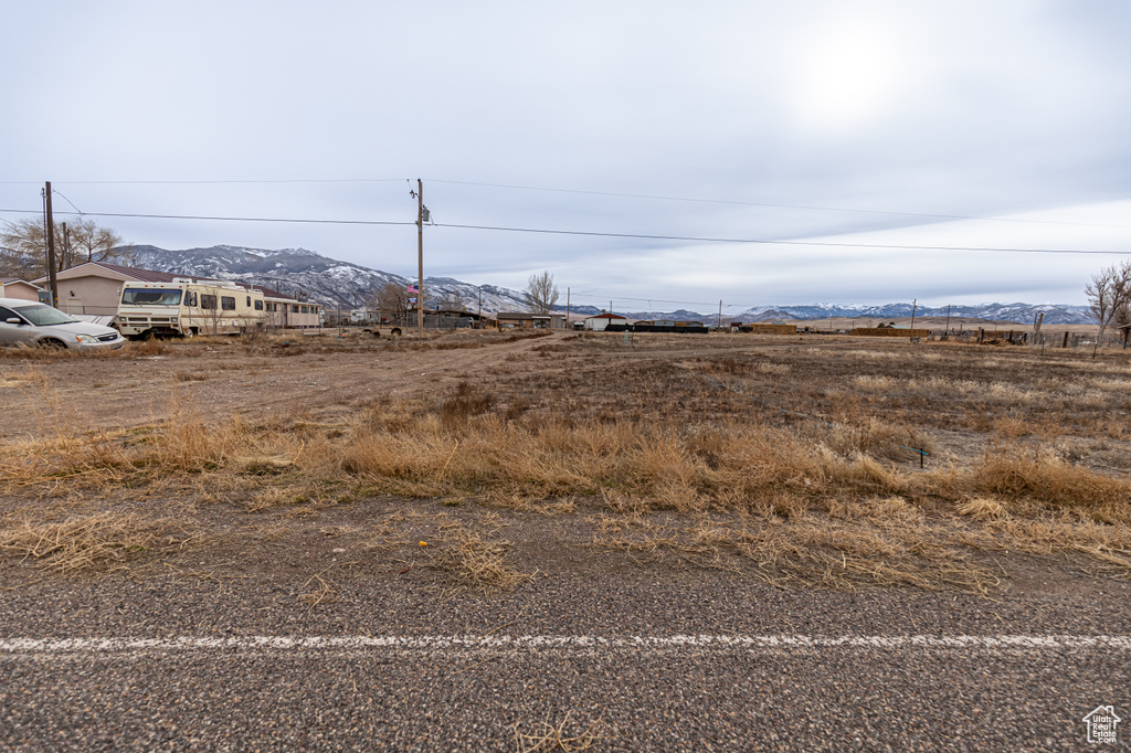 View of yard featuring a mountain view and a rural view