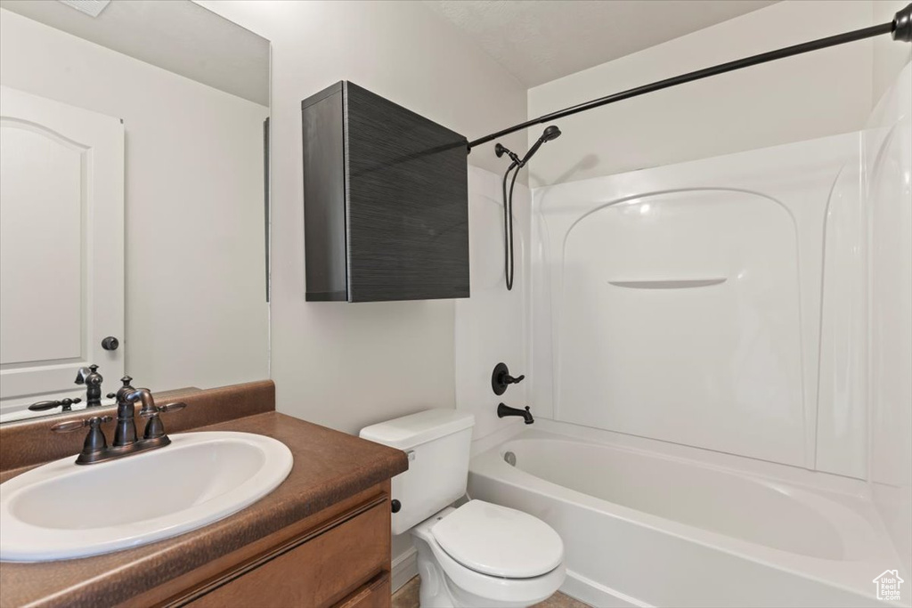 Full bathroom with vanity, toilet, and shower / bathing tub combination