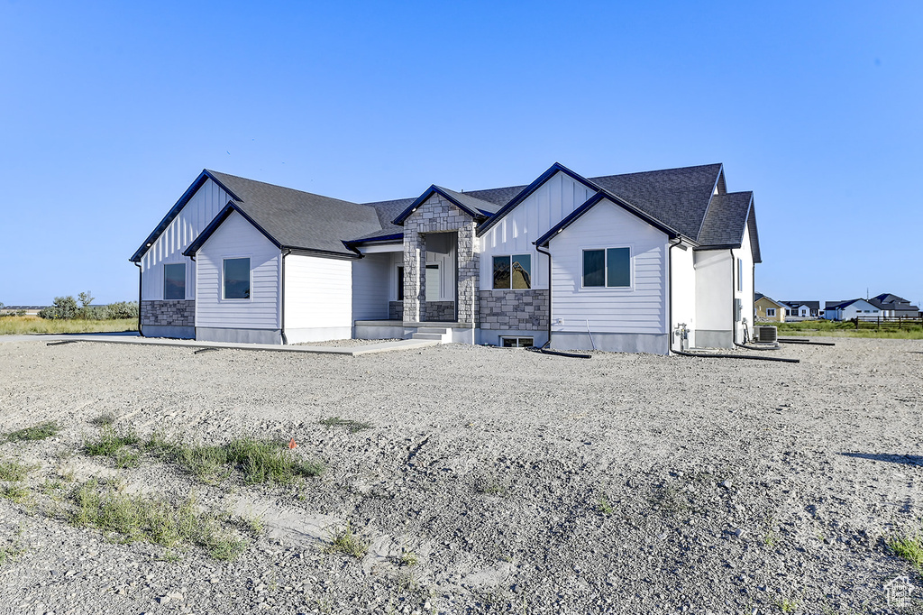 View of front of home with cooling unit