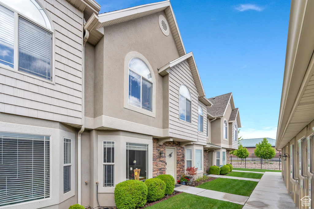 Exterior space featuring a front yard