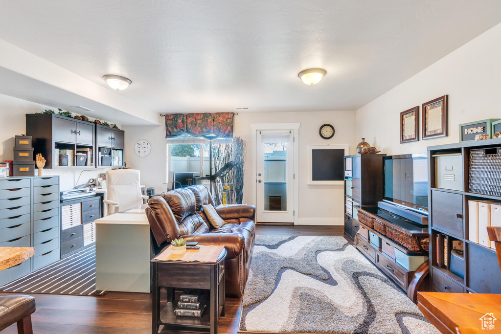 Living room with dark hardwood / wood-style floors