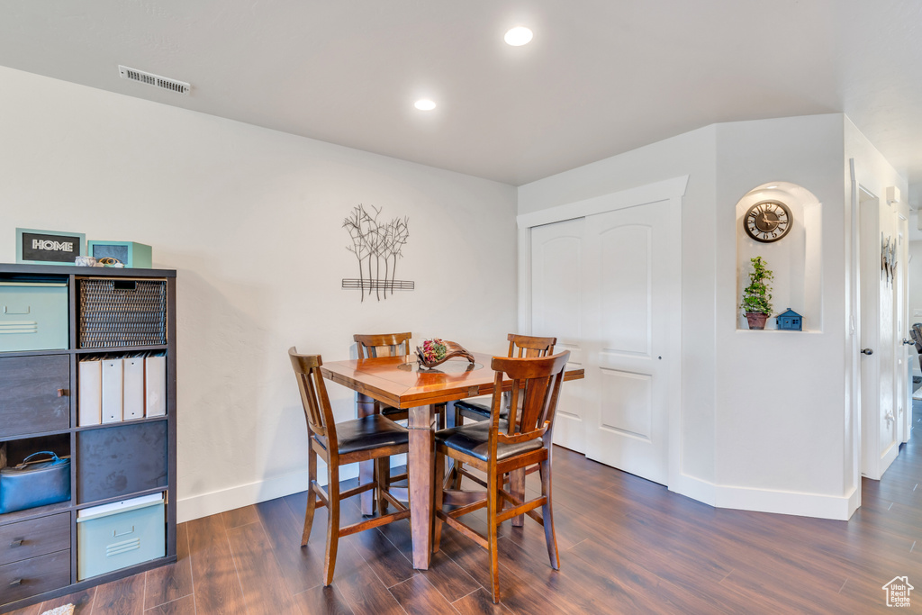 Dining area featuring dark hardwood / wood-style flooring