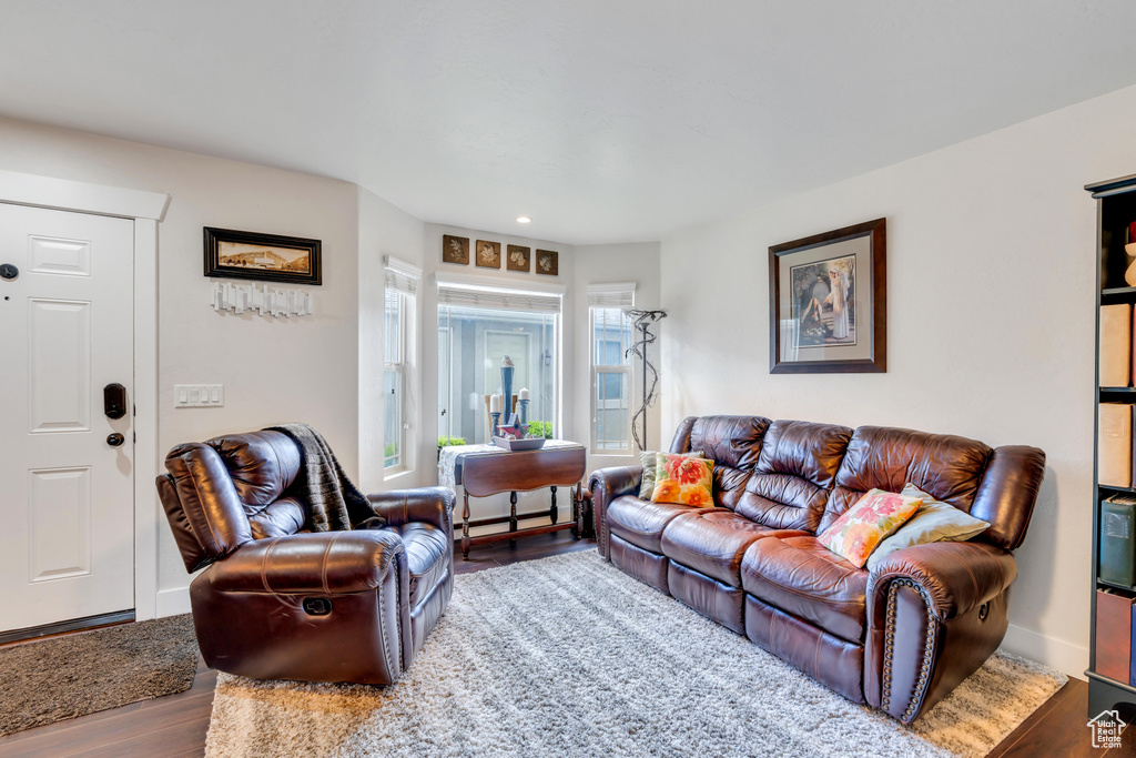 Living room with hardwood / wood-style flooring