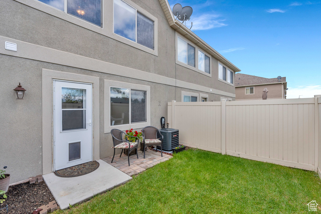 Exterior space featuring a patio area and central air condition unit