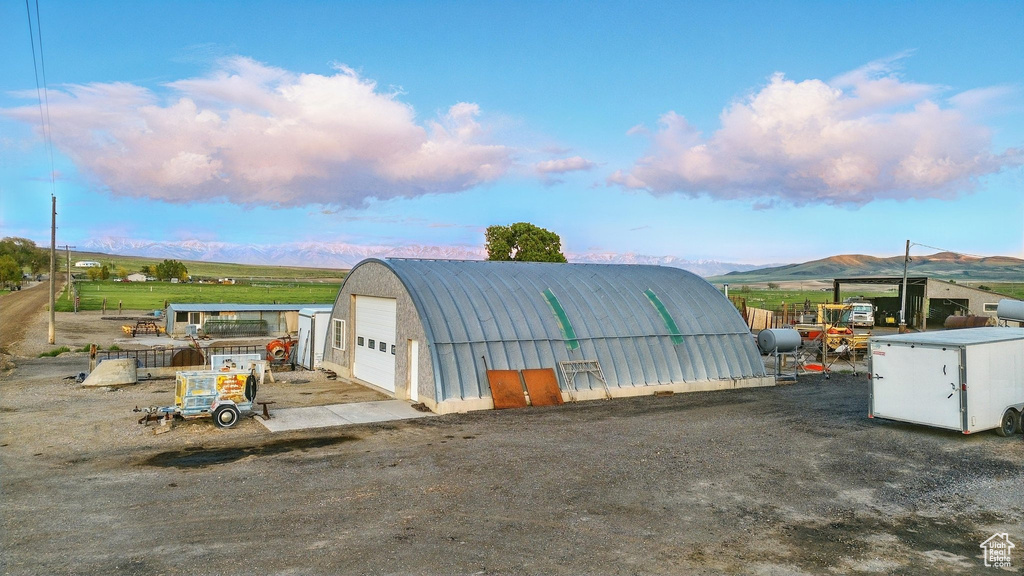 View of outbuilding featuring a mountain view