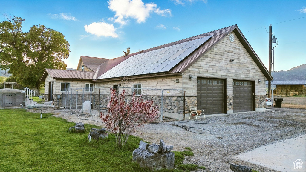 Detached garage with roof mounted solar panels
