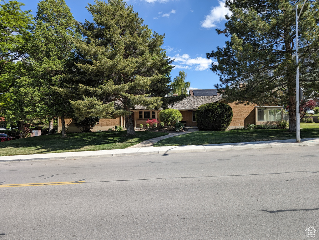 View of front of house with a front yard