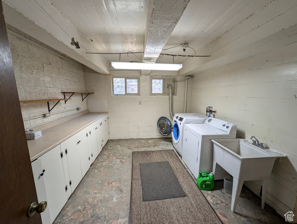 Clothes washing area with washing machine and clothes dryer and cabinets