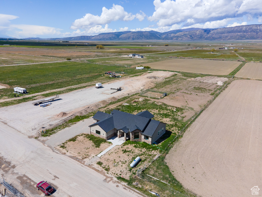 Birds eye view of property with a mountain view and a rural view