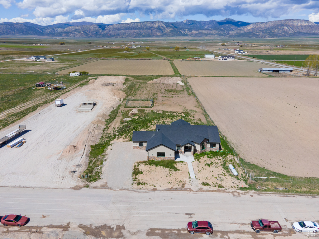 Drone / aerial view with a mountain view and a rural view