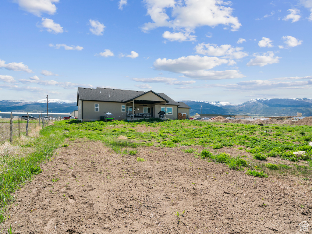 Exterior space with a mountain view and a rural view