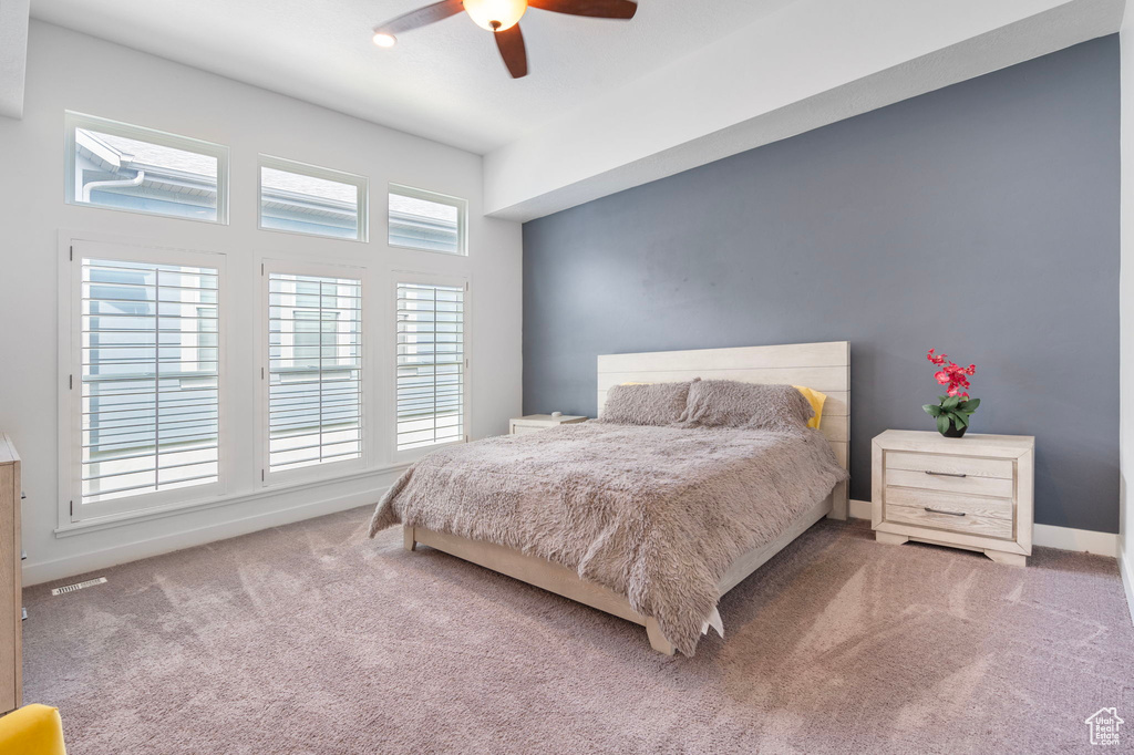 Bedroom with ceiling fan and carpet floors