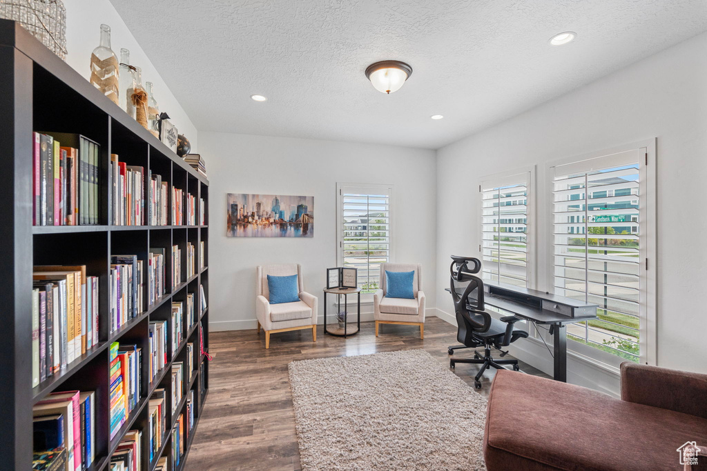 Office featuring hardwood / wood-style flooring and a textured ceiling