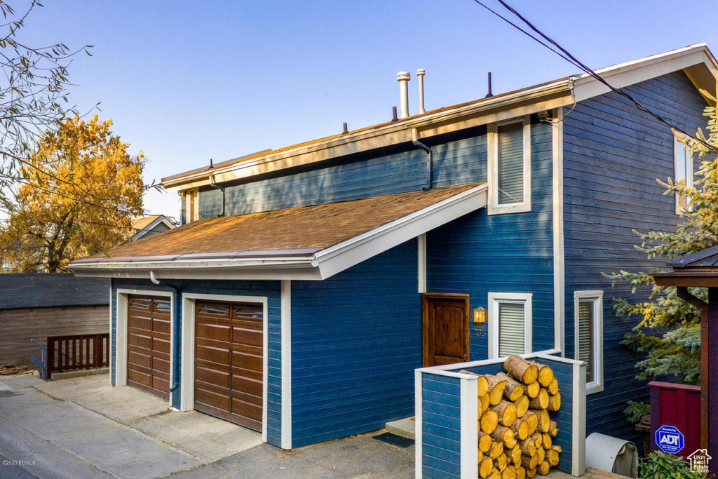 View of front of property featuring a garage