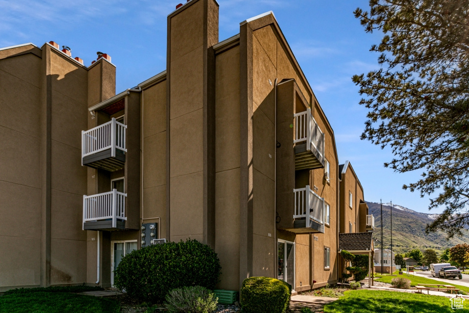 View of building exterior featuring a mountain view