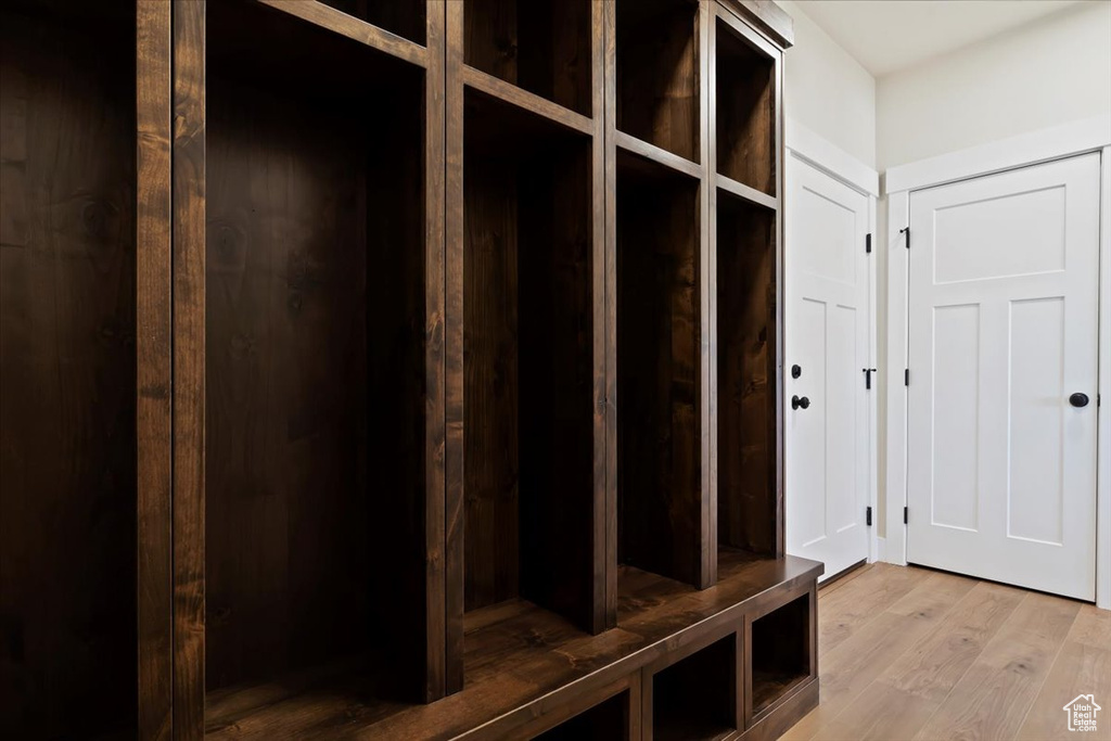 Mudroom with light hardwood / wood-style floors