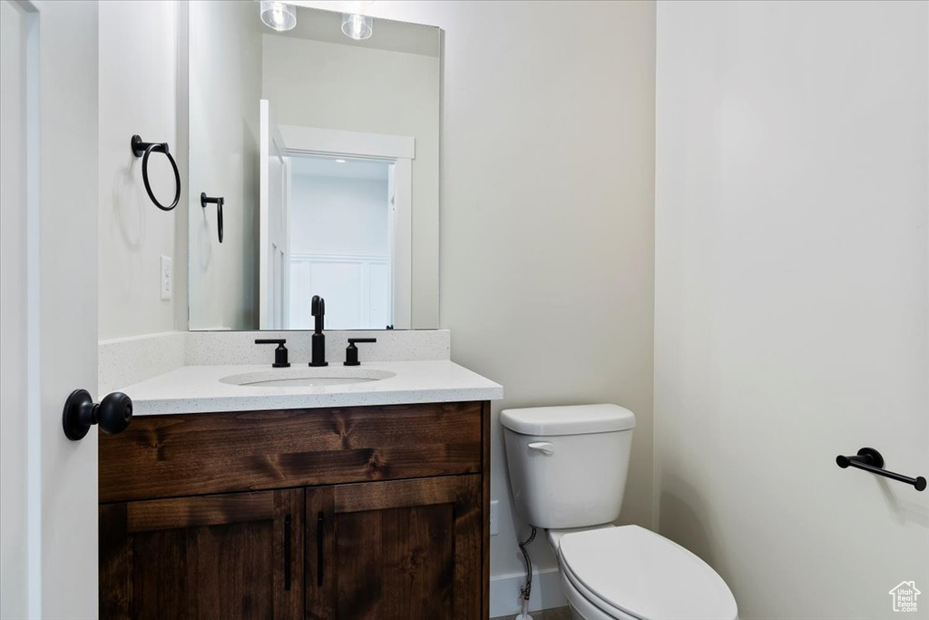 Bathroom featuring vanity and toilet