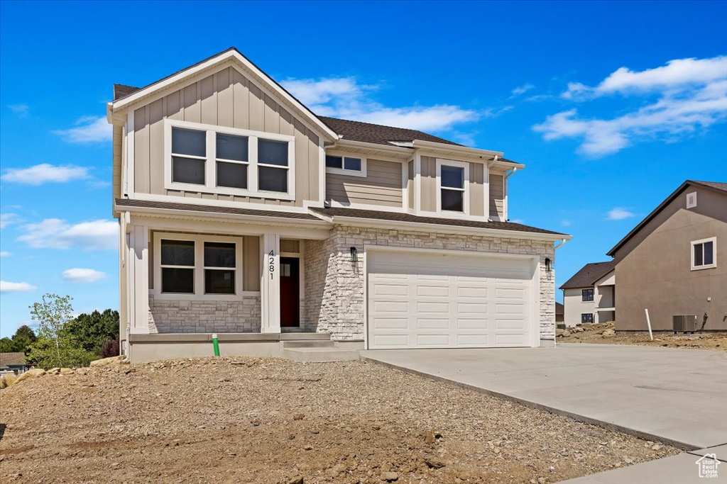 View of front facade featuring a garage