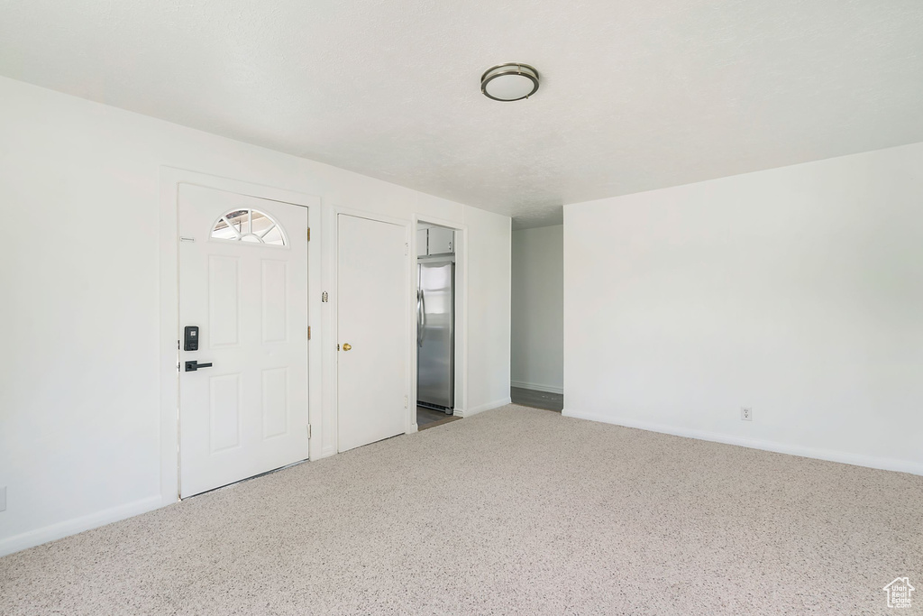 Interior space featuring stainless steel fridge