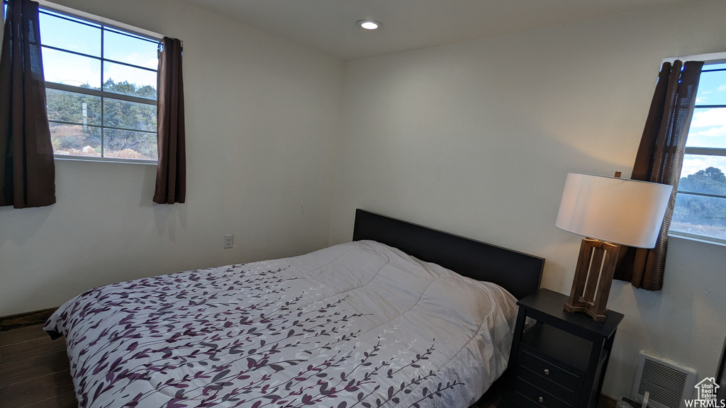 Bedroom featuring dark hardwood / wood-style floors