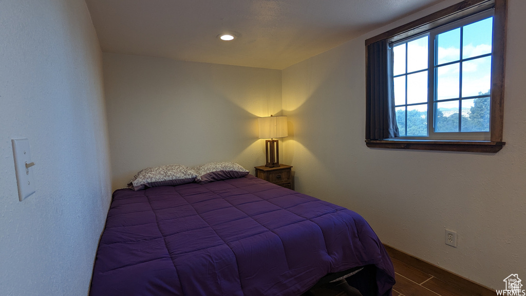 Bedroom featuring wood-type flooring