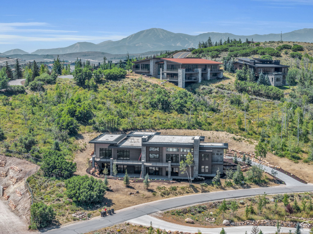 Birds eye view of property with a mountain view