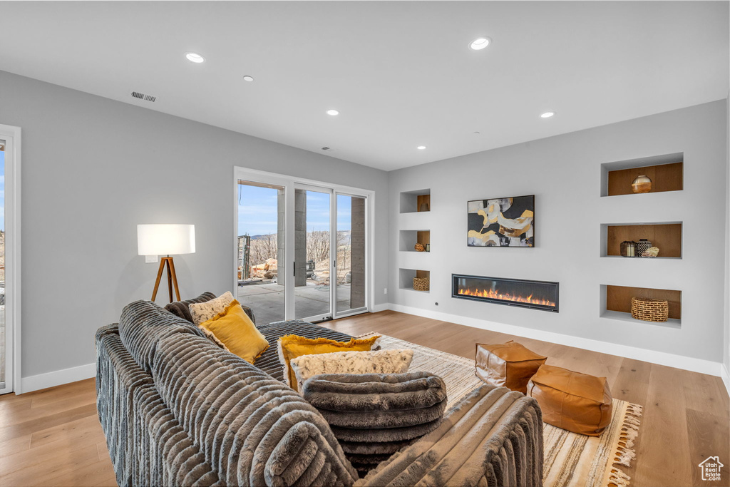 Living room with light wood-type flooring