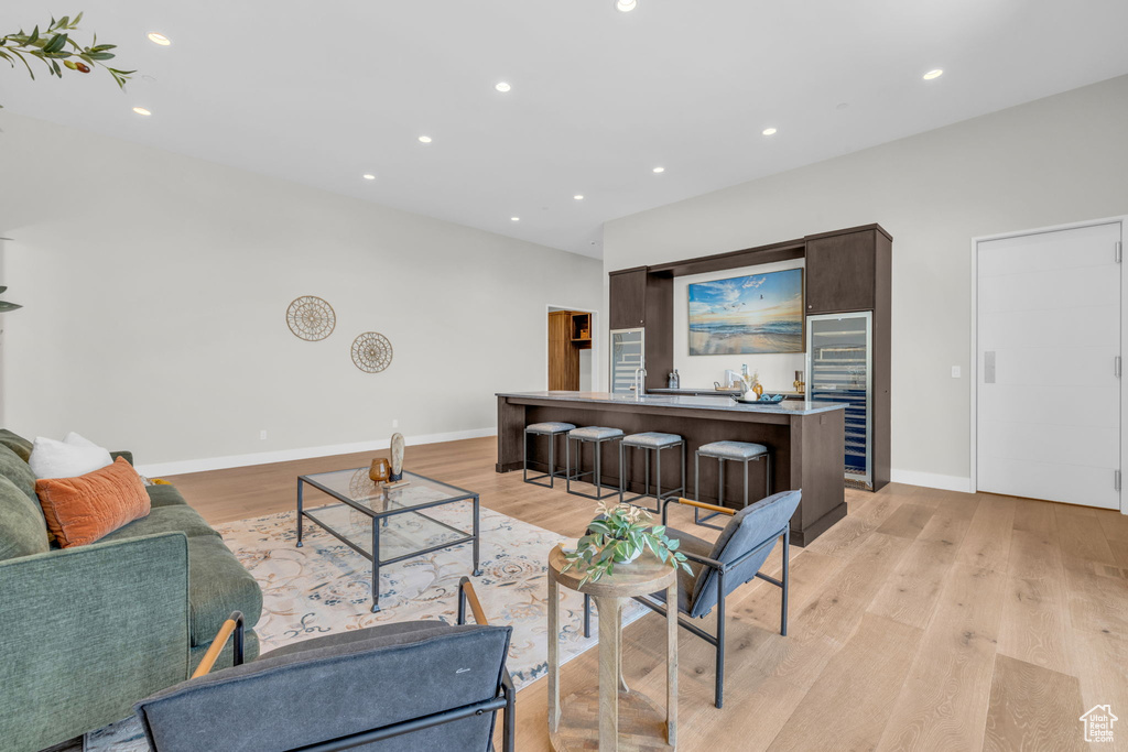 Living room with light hardwood / wood-style flooring