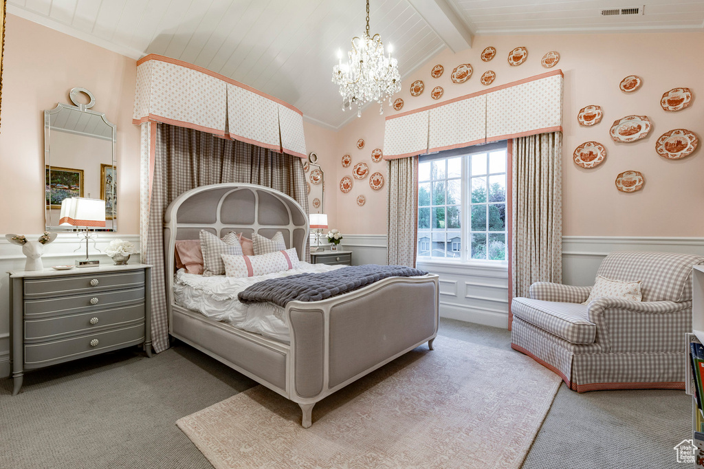 Carpeted bedroom with an inviting chandelier, vaulted ceiling with beams, and wooden ceiling