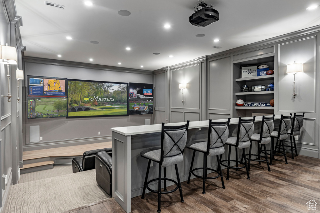 Cinema room with dark hardwood / wood-style floors