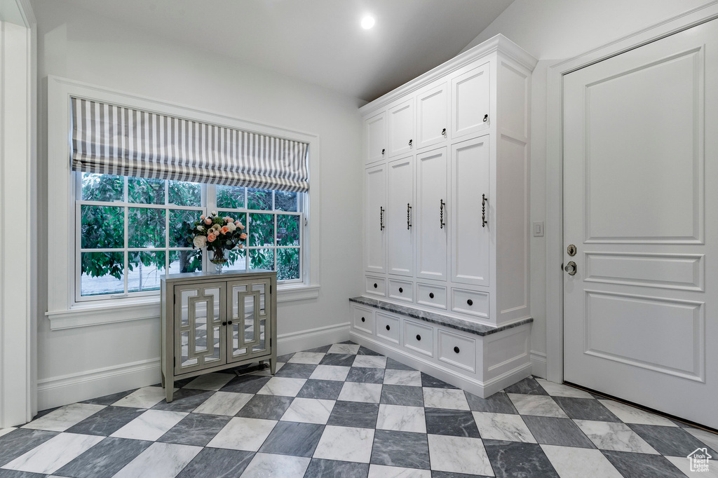 Mudroom with light tile floors