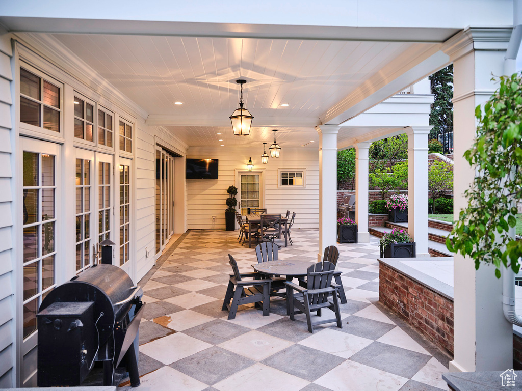 View of patio featuring a grill