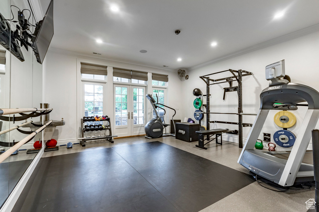 Workout area featuring french doors and crown molding